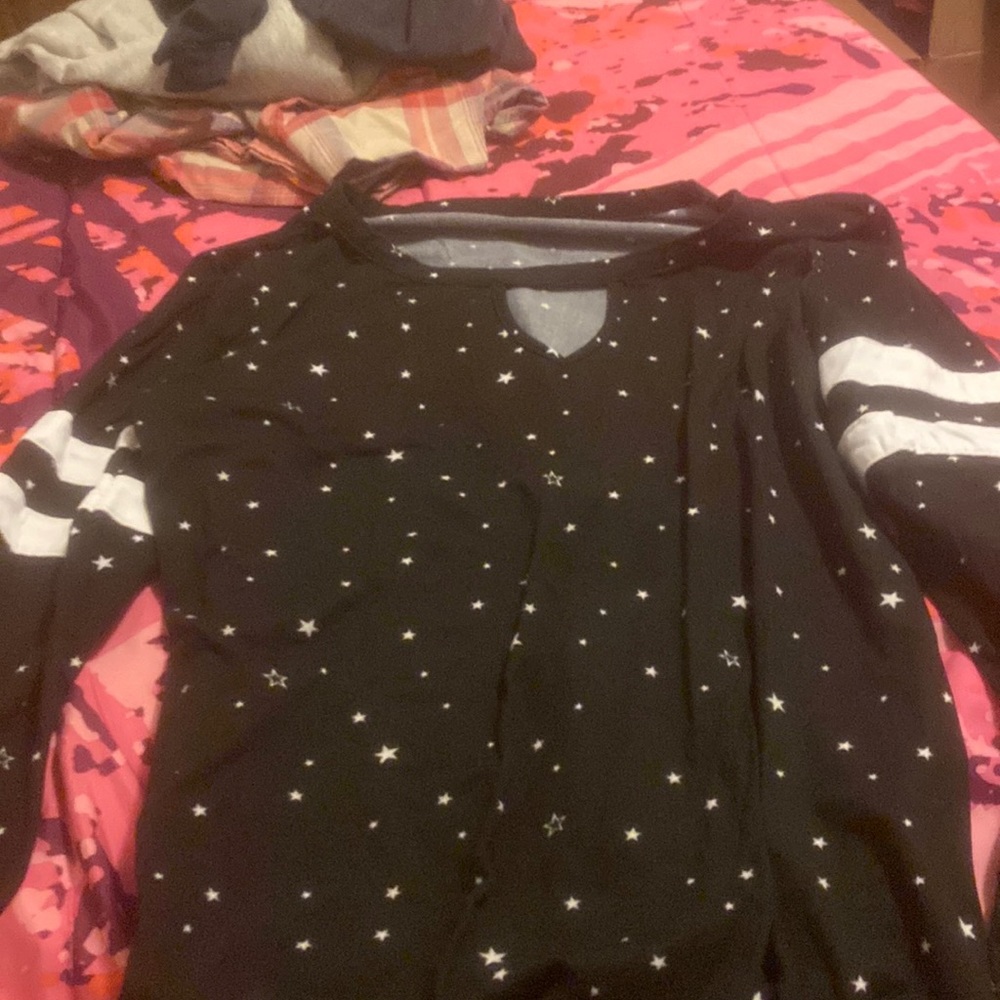 Black long sleeve with a open ish top with white stars